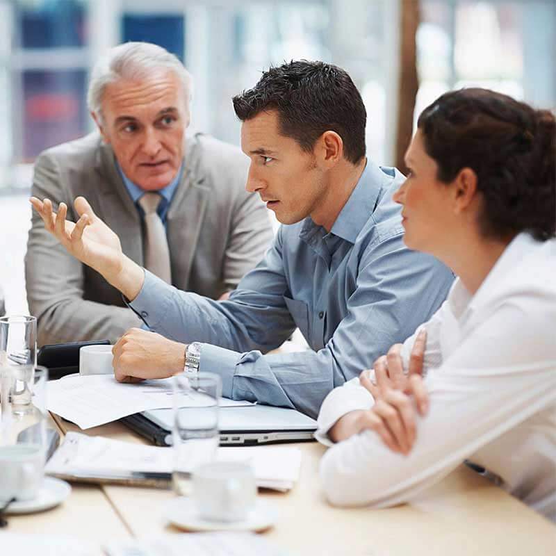 The GreatInflux team collaborating on a client marketing strategy